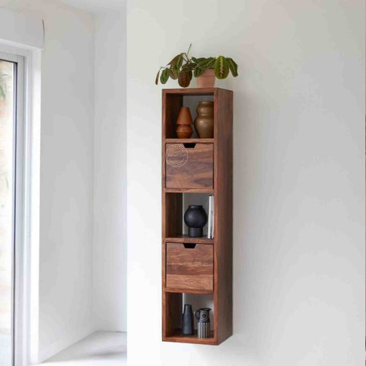 bluewud wall rack is handcrafted with sheesham wood. Featuring a honey finish, 2 drawers and a design that is easy to hang on the wall.