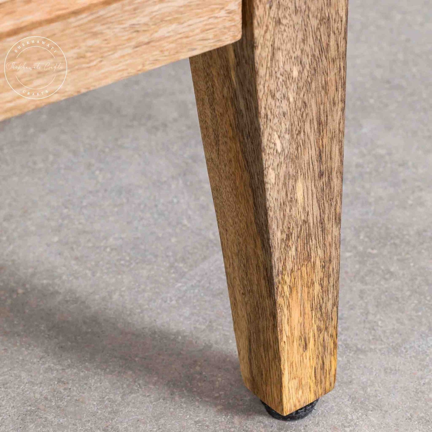 Brayan sideboard is handcrafted with mango wood. It has 3 doors and internal shelves for storage.