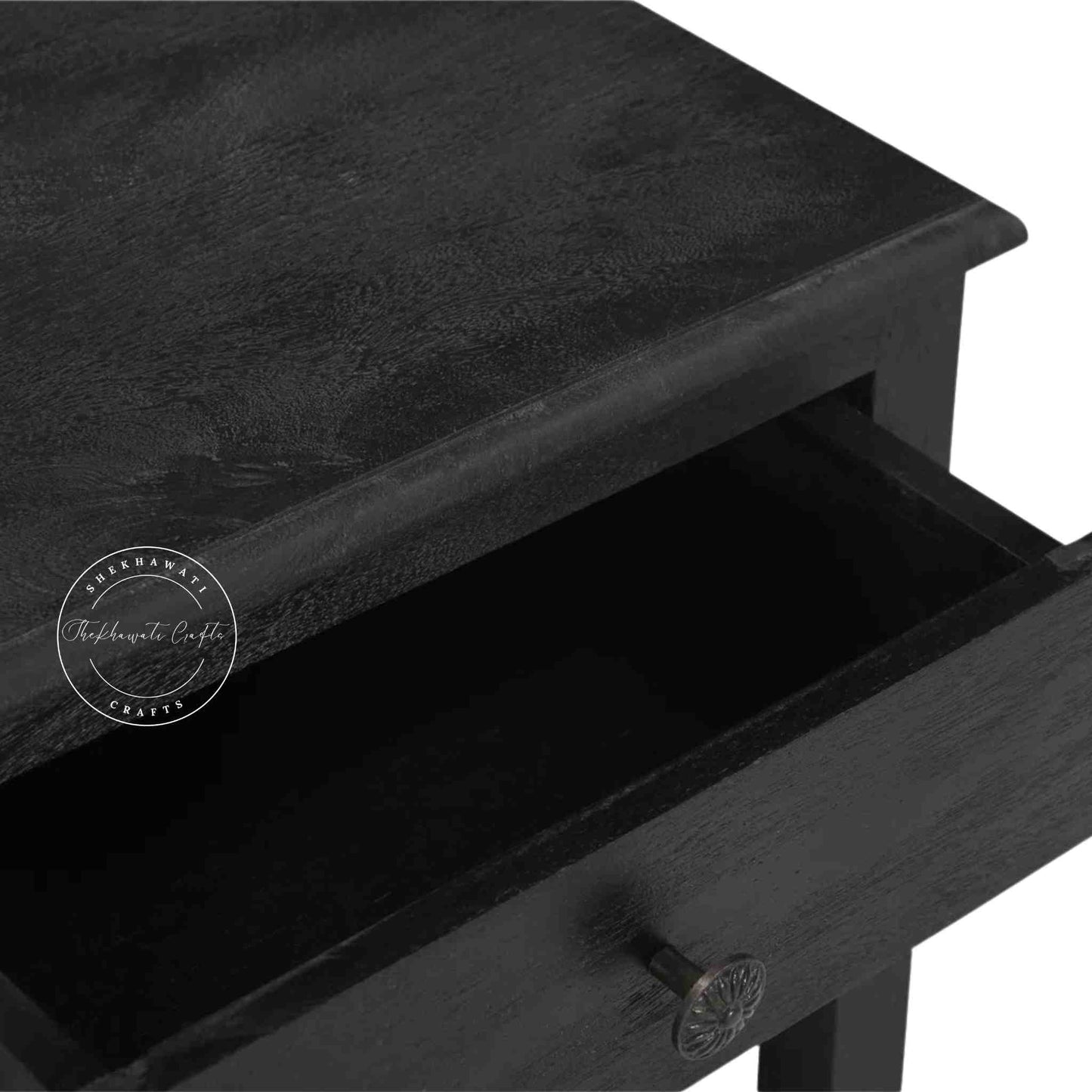 Evie bedside table is crafted from mango wood and a matte black finish.