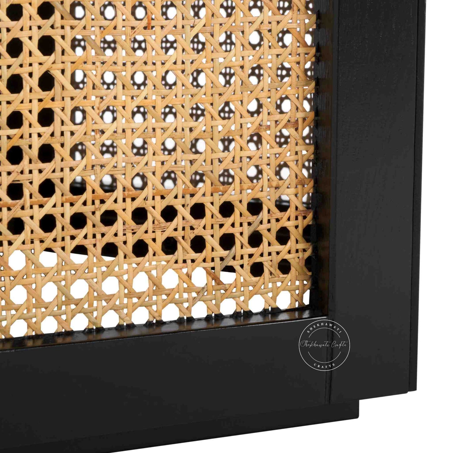 hexacane rattan coffee table is crafted from mango wood with rattan cane and matte black finish.
