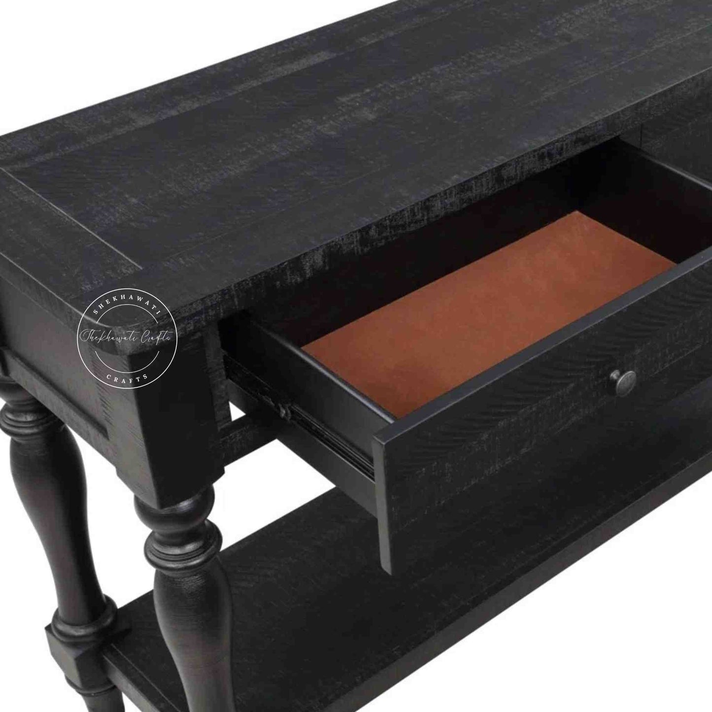 Julian console table is handcrafted from mango wood and a matte black finish.
