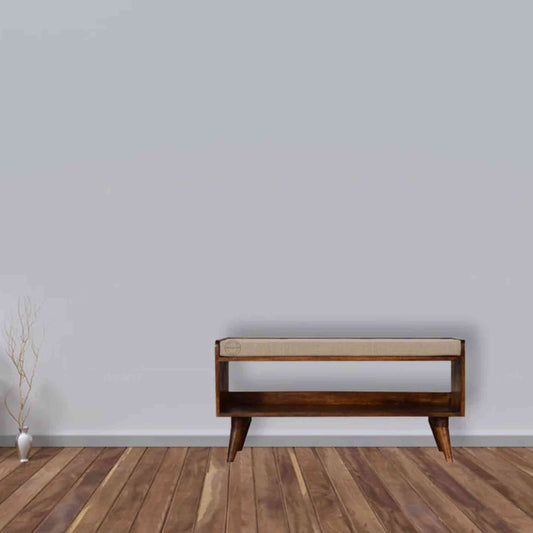 Lammi Bench is handcrafted with sheesham wood, cushion, honey finish, detachable legs and a storage shelf.
