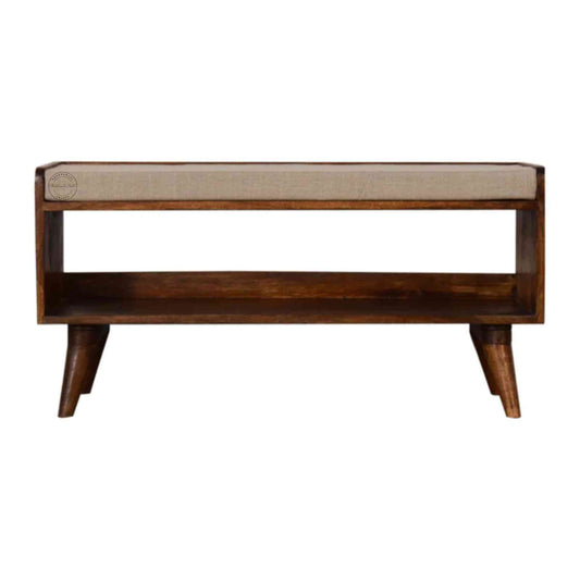 Lammi Bench is handcrafted with sheesham wood, cushion, honey finish, detachable legs and a storage shelf.