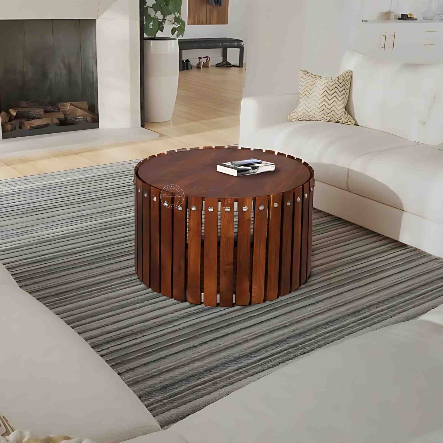Handcrafted from Sheesham wood, the Leore Coffee Table features a round shape design and warm honey finish.