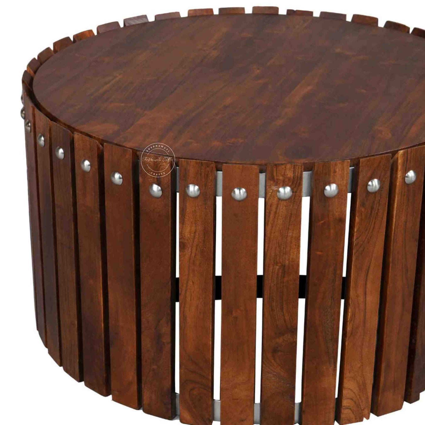 Handcrafted from Sheesham wood, the Leore Coffee Table features a round shape design and warm honey finish.