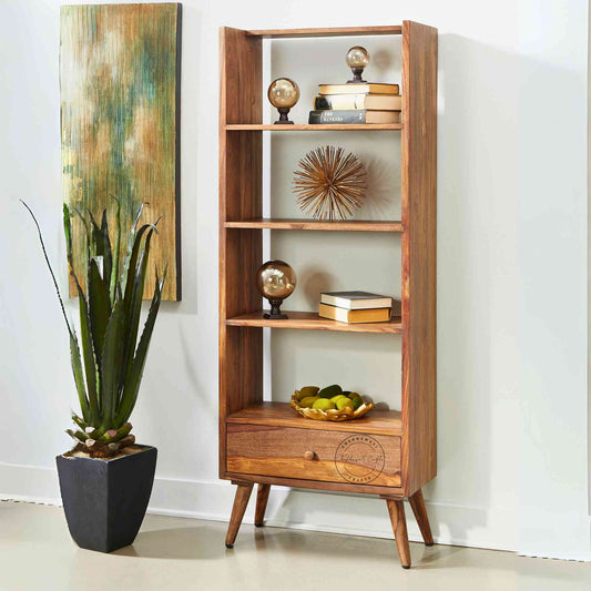 Libro Bookshelvesia is handcrafted with sheesham wood, a honey finish, 3 shelves and a bottom drawer.