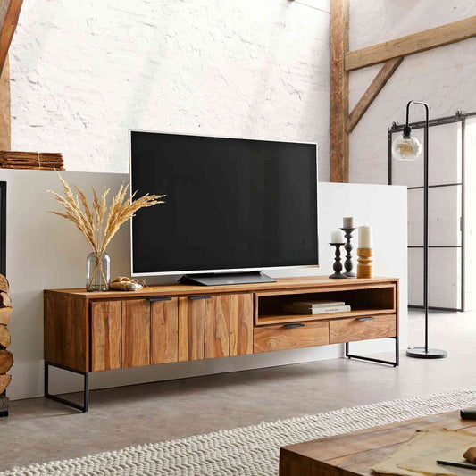 Monroe TV Cabinet is handcrafted with sheesham wood and iron legs. Features a natural finish, 2 drawers, an open shelf and 2 doors.