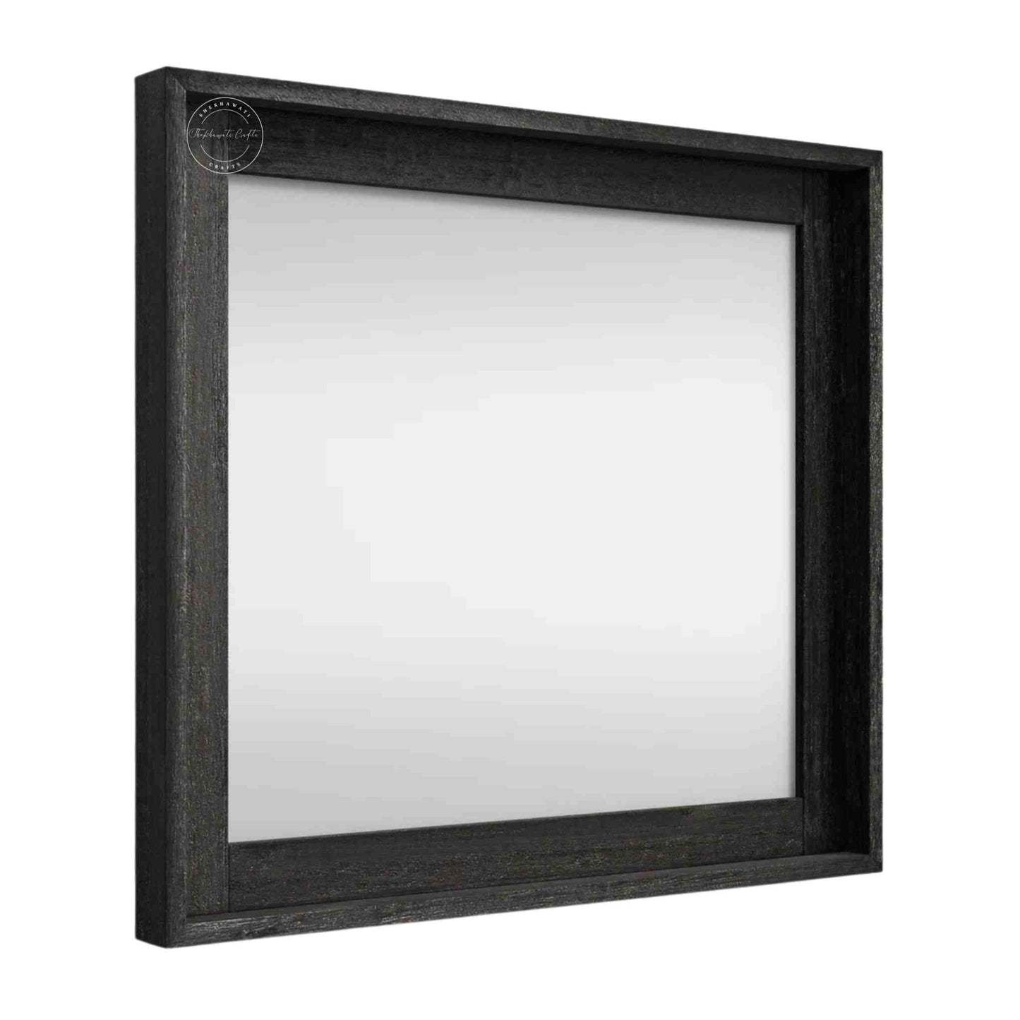 Noir mirror frame is crafted from mango wood with a matte black finish.