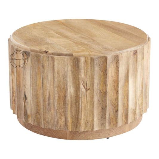 Ossa Coffee Table is handcrafted from mango wood with a round curved design and natural finish.