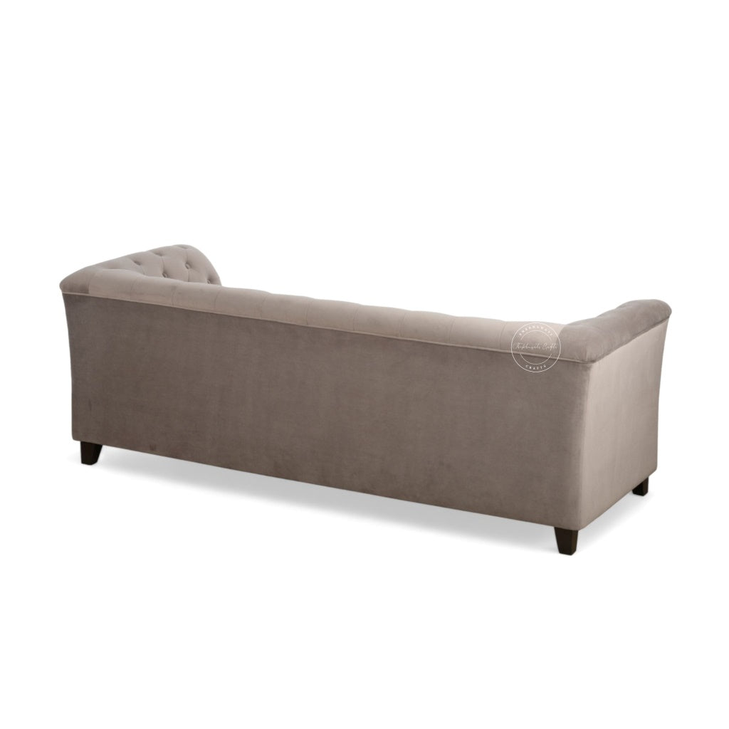 backside view of classic tufted loveseat sofa upholstered in a textured taupe fabric, featuring dark wooden legs, shown against a plain white background