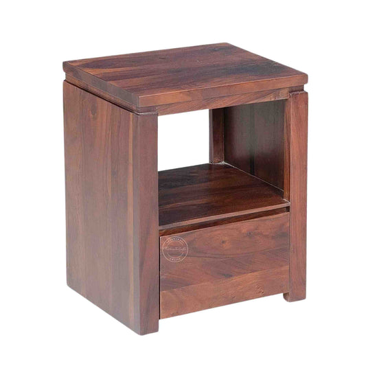 Side view of a wooden bedside table made of sheesham wood with a honey finish, featuring a drawer and an open shelf.