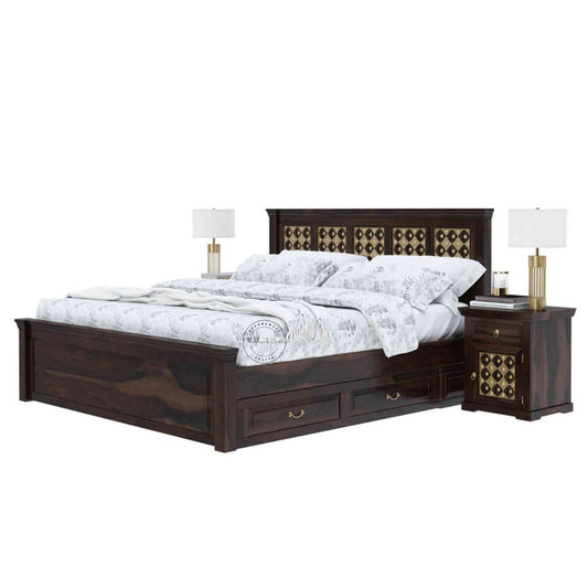 A king-size wooden bed with brass inlays and storage drawers, in a room with light walls.