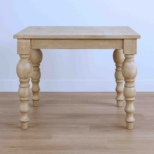 handmade spindle mango wood dining table in natural mango wood finish and vintage design legs.
