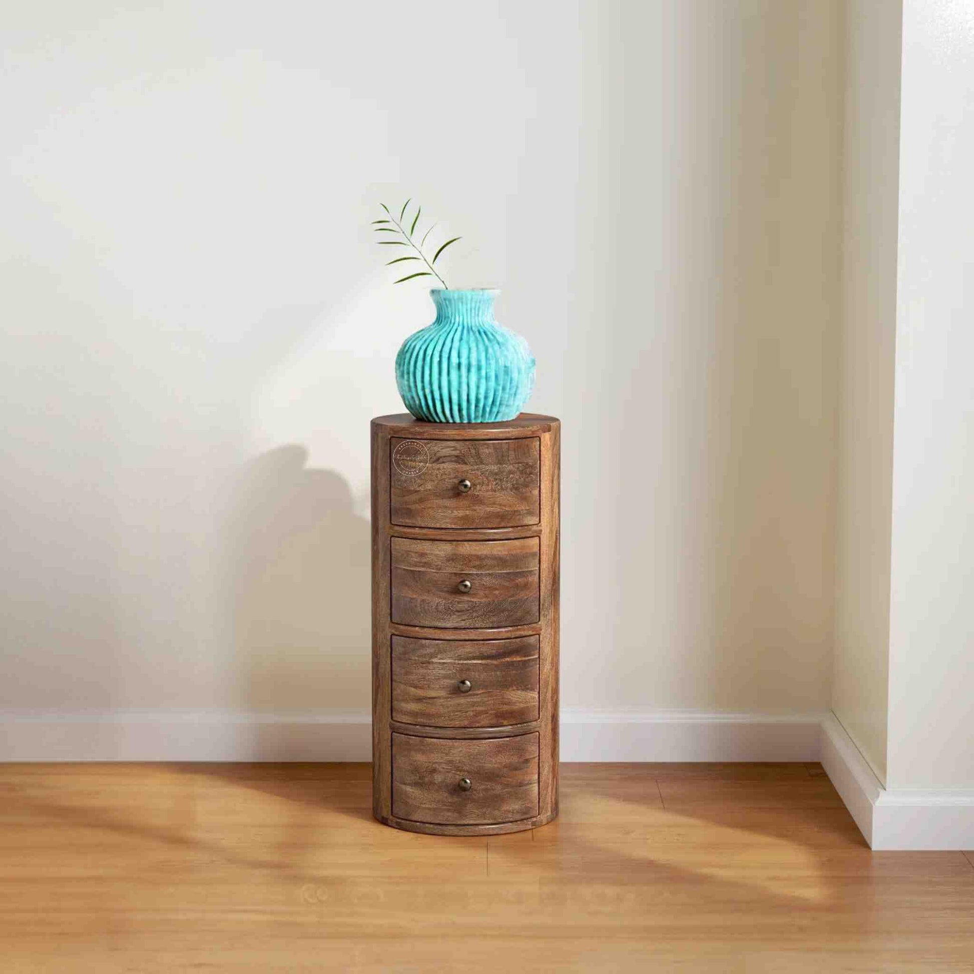 Teshio 4 drawer round shape accent side table with natural finish.