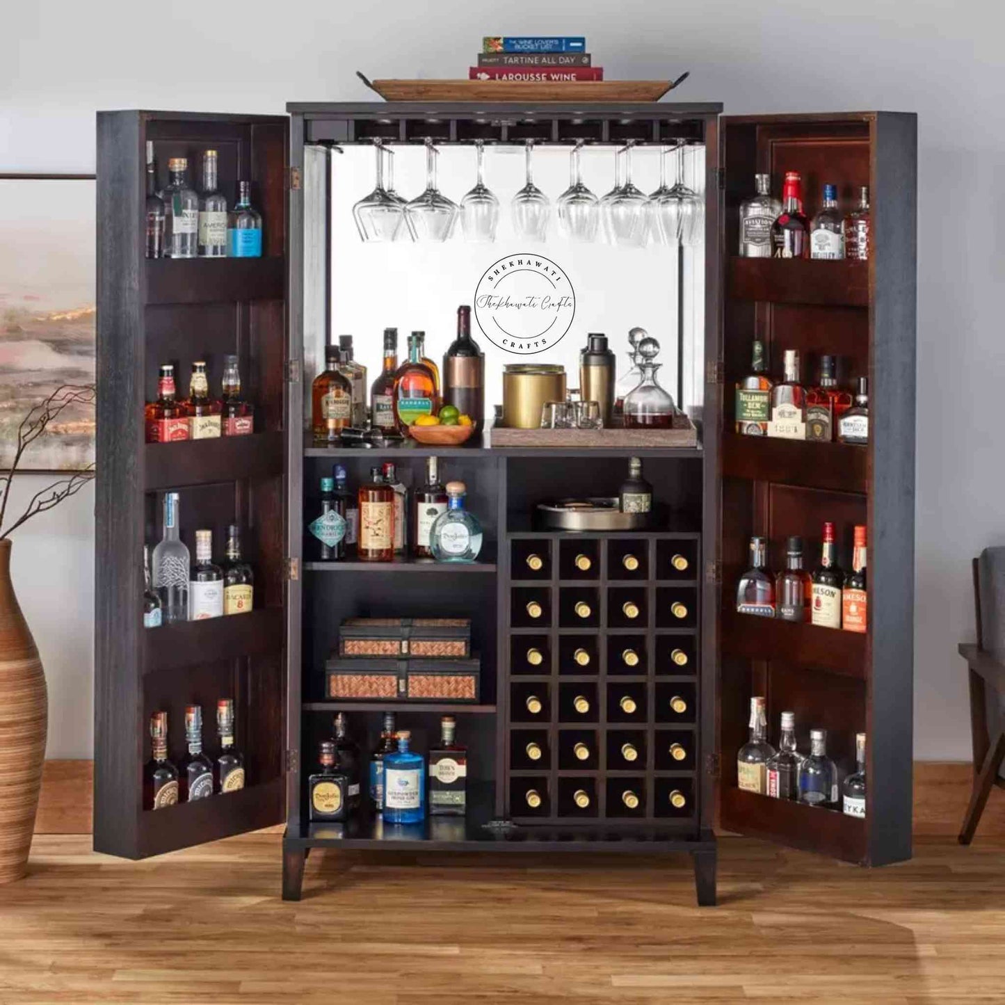 The Pint Bar Cabinet is handcrafted with mango wood and a dual tone finish, 2 doors, bottles and glass sections.