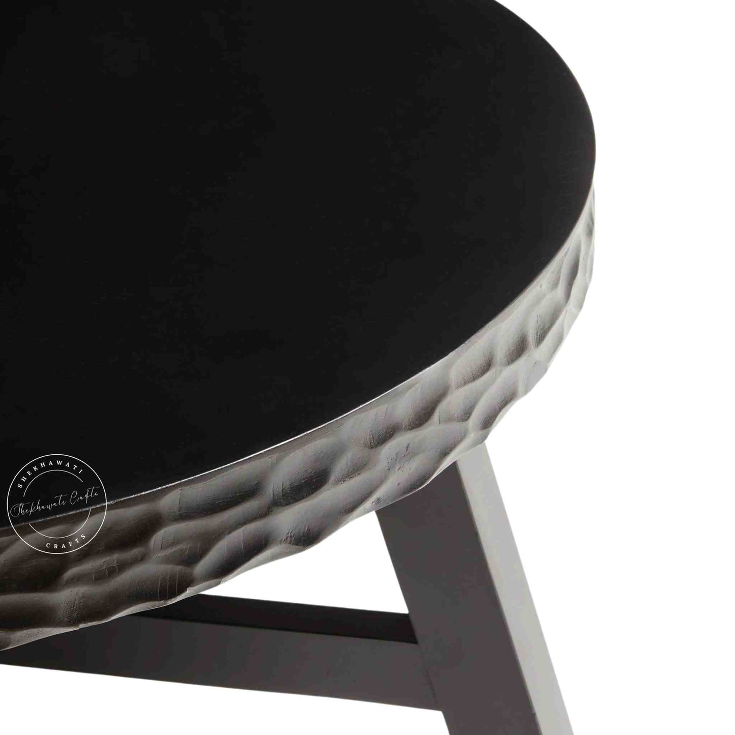 handcrafted Uma Sheesham Wood Coffee Table with matte black finish and round shape design.