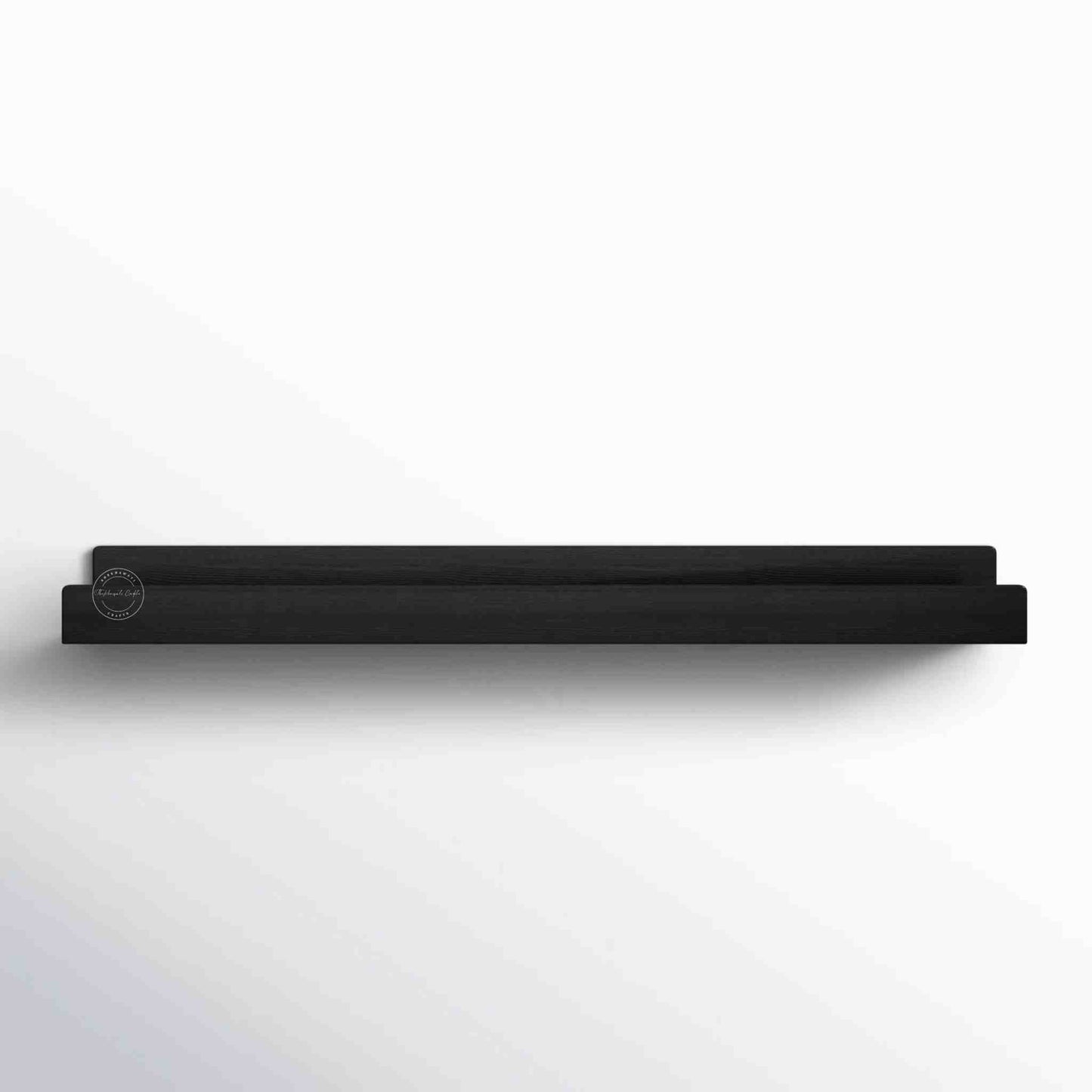 handcrafted Veda mango wood hanging wall shelf in matte black finish.