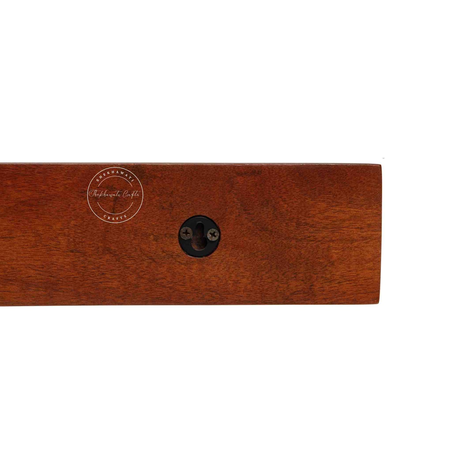 handcrafted Veda mango wood hanging wall shelf in honey finish.