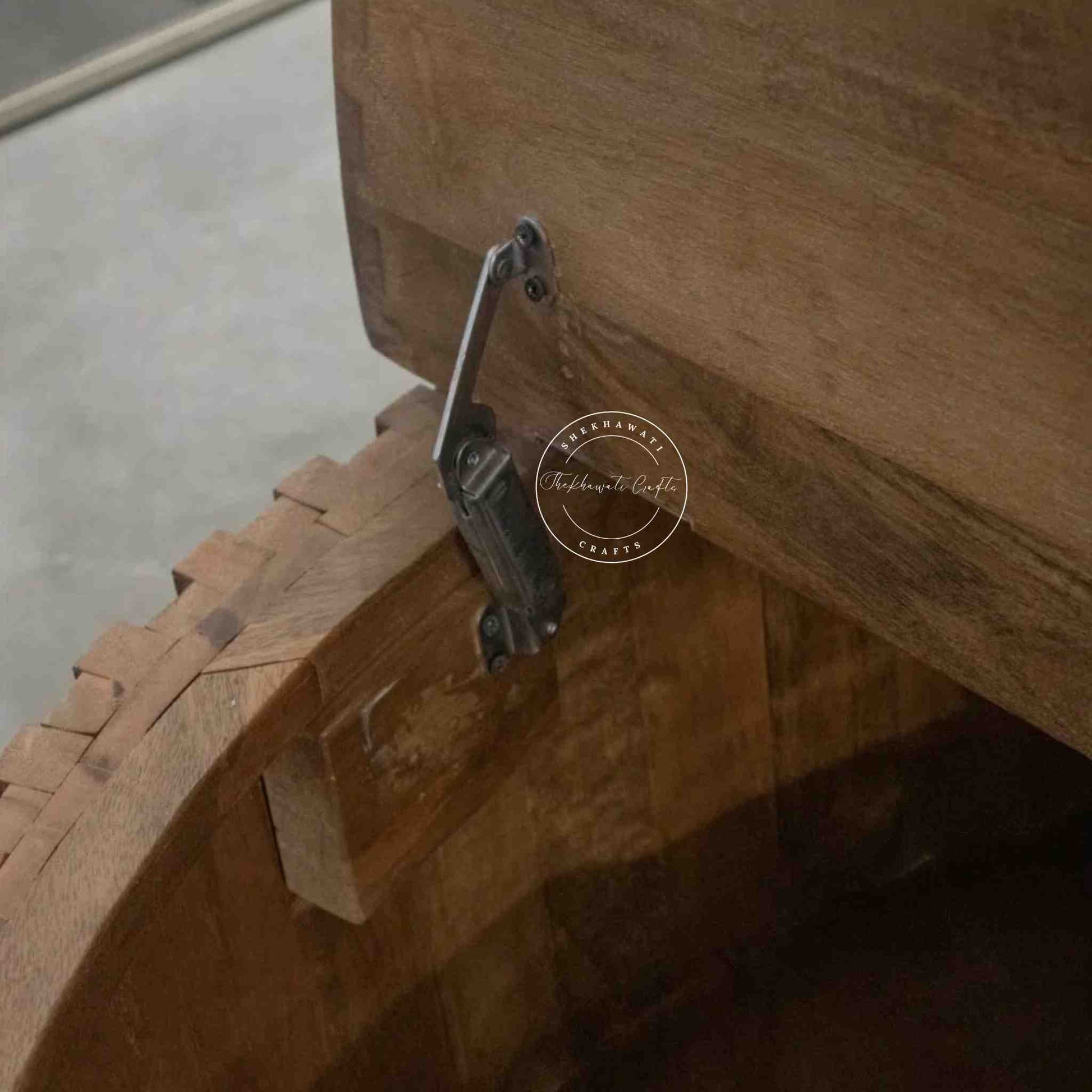 Venessa coffee table is handcrafted from mango wood with walnut finish and storage compartment.