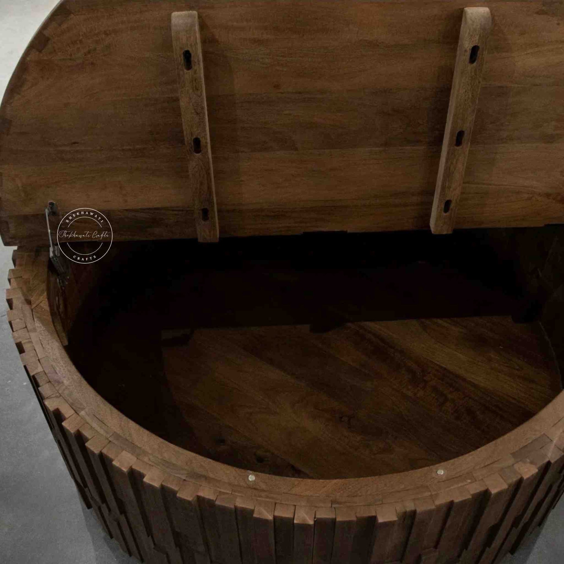 Venessa coffee table is handcrafted from mango wood with walnut finish and storage compartment.