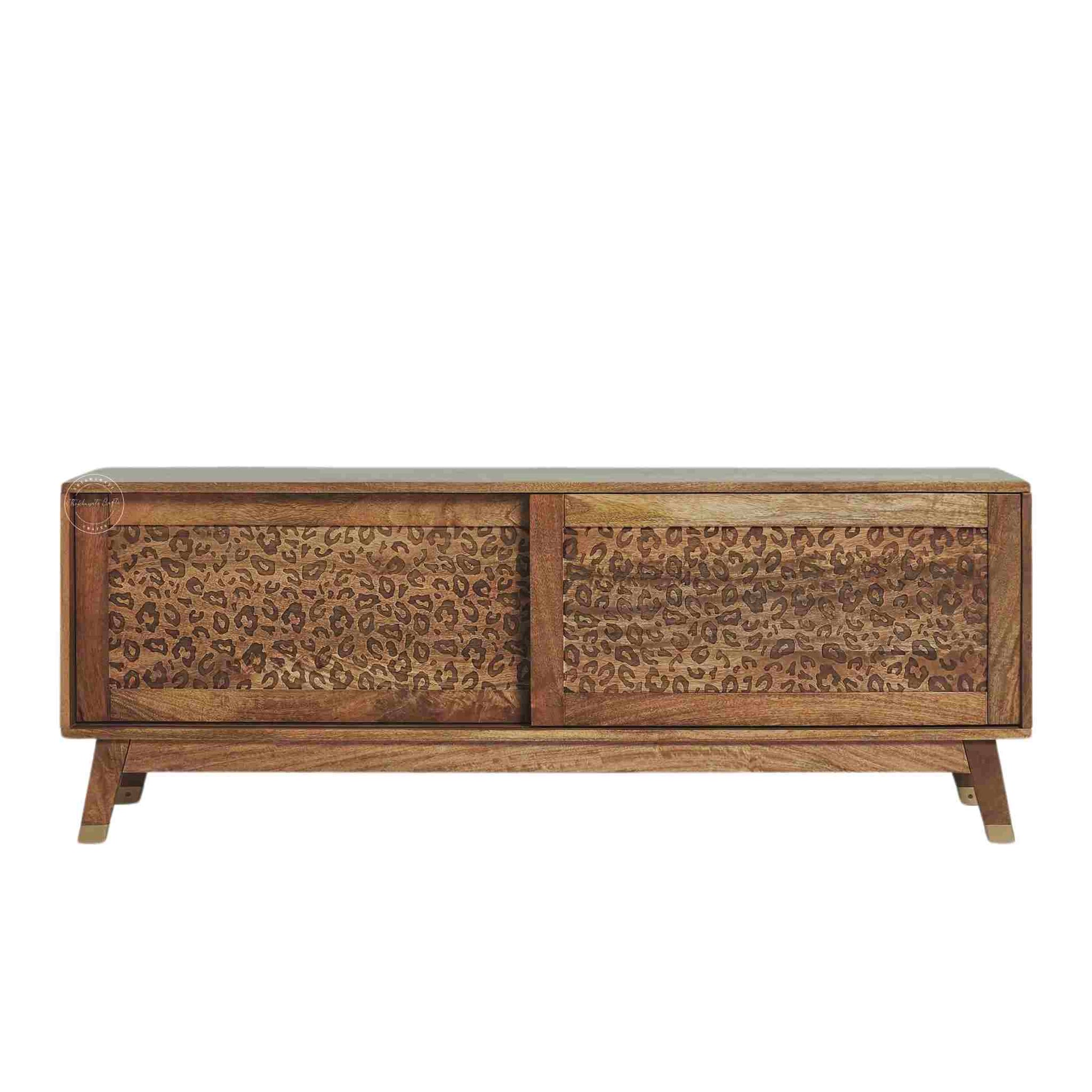 The Aarika handcrafted wooden TV cabinet is made from mango wood and features sliding doors.