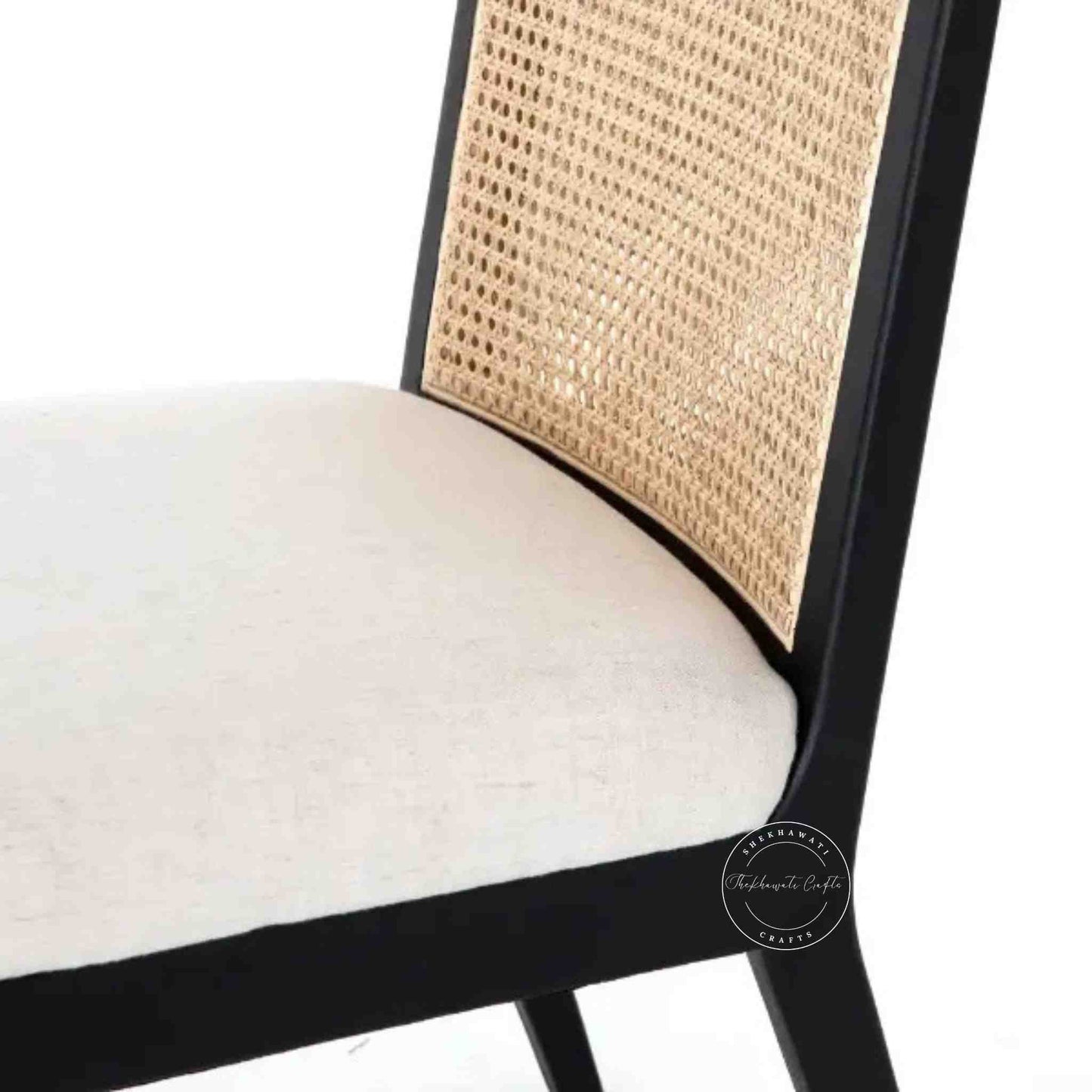 handcrafted Anvi Chair is made with sheesham wood and ratan cane design backrest.