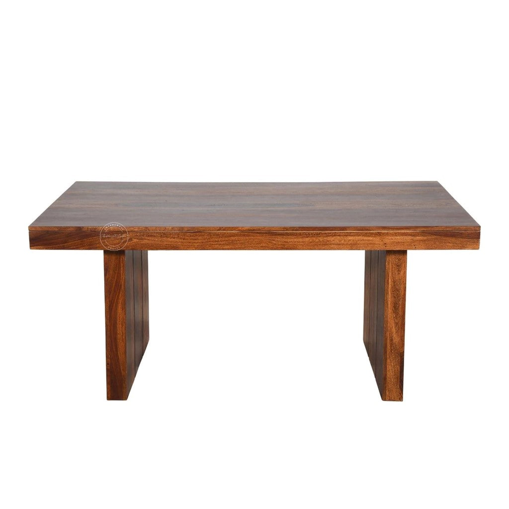 A rectangular wooden table with a thick, edge top and two blocky, tapered legs, shown against a plain white background.