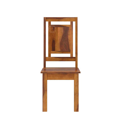 A wooden dining chair with a warm medium-brown finish and visible natural wood grain patterns, shown against a plain white background.