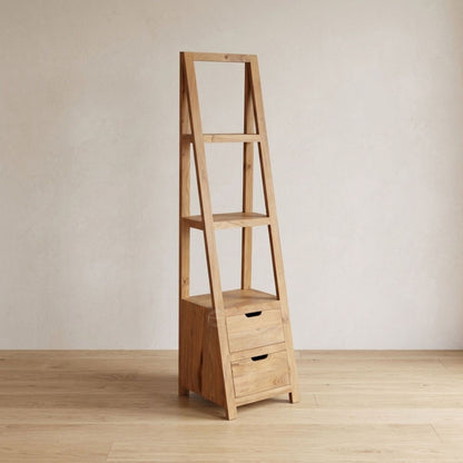 An acacia wood A-frame ladder shelf with three open shelves and a small two-drawer storage base, shown standing on a light wood floor against a neutral beige wall.