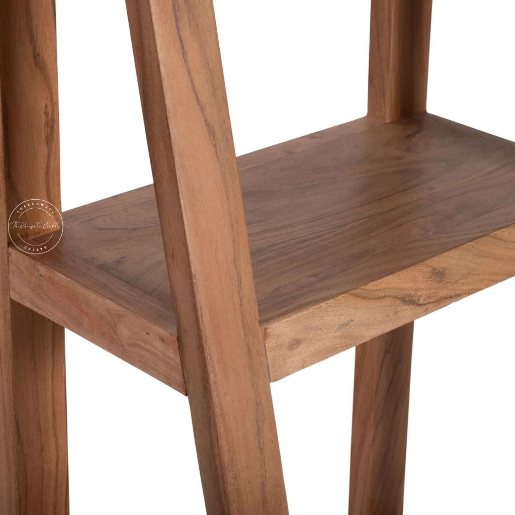 Close-up of a wooden ladder shelf with a warm medium-brown finish and visible wood grain, shown against a white background.