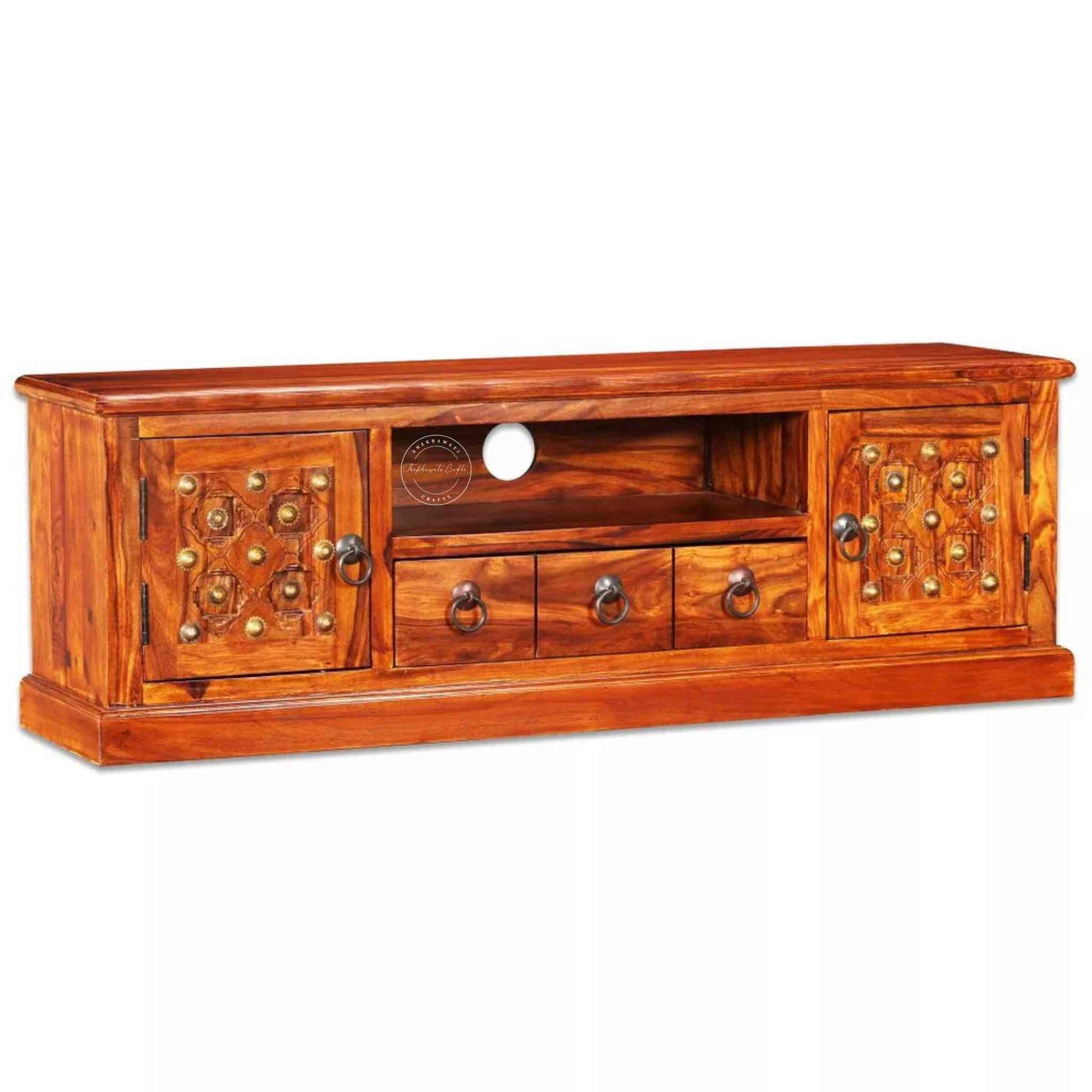 Bakhra TV Cabinet is handcrafted from sheesham wood with a natural finish, 2 Bakhra design doors and 1 drawer.