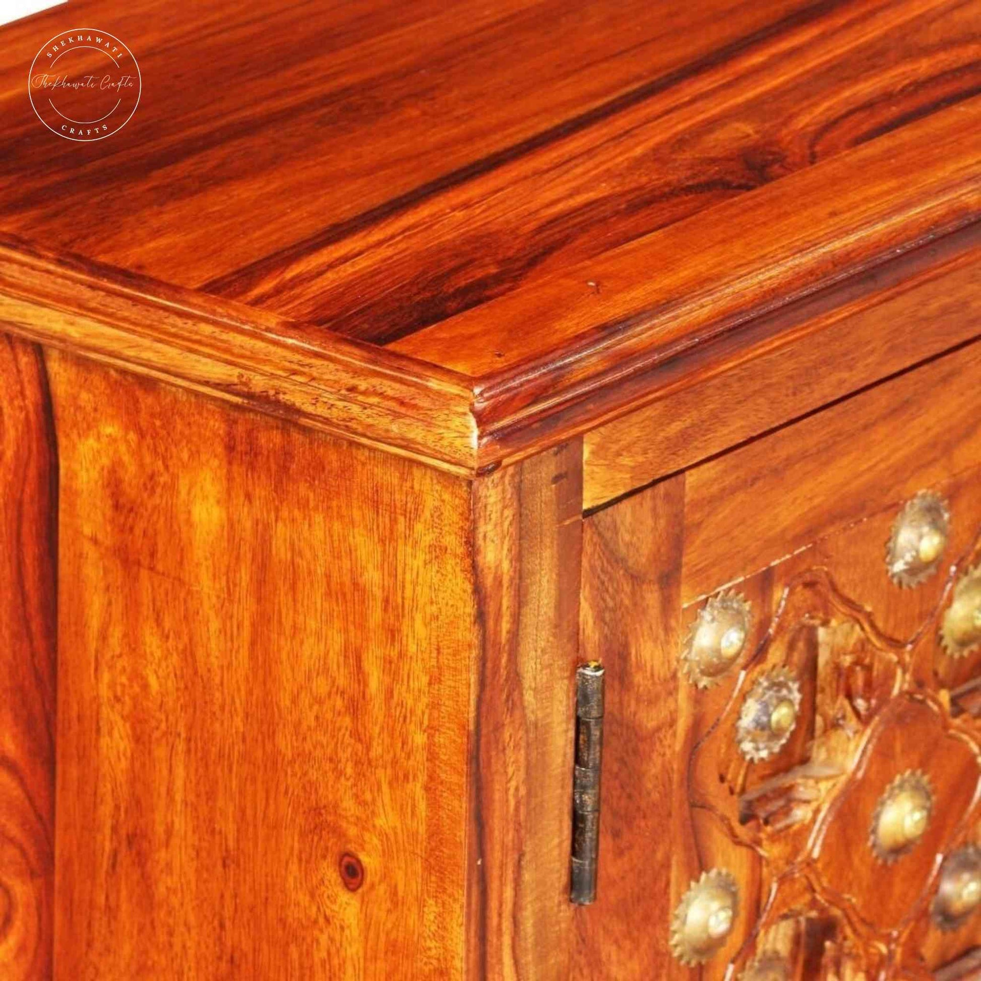Bakhra TV Cabinet is handcrafted from sheesham wood with a natural finish, 2 Bakhra design doors and 1 drawer.