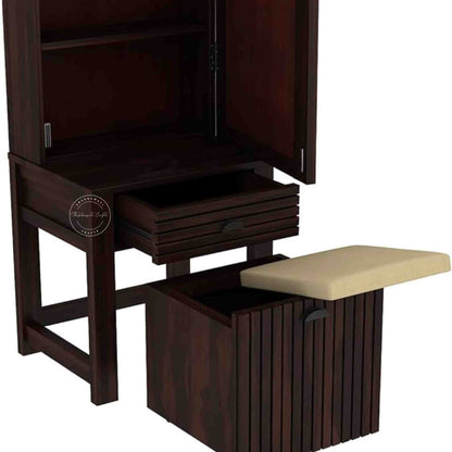 The Bergen dressing table is handcrafted from sheesham wood, featuring a mirrored storage door, one drawer, and a stool with storage options.