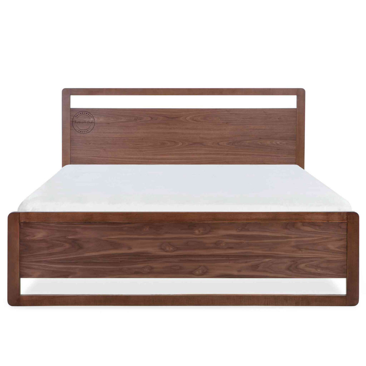 A king-size bed made of Sheesham wood with a headboard and footboard in white background.