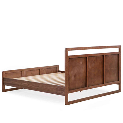 Back side view of a king-size bed made of Sheesham wood with a headboard and footboard in a white background.