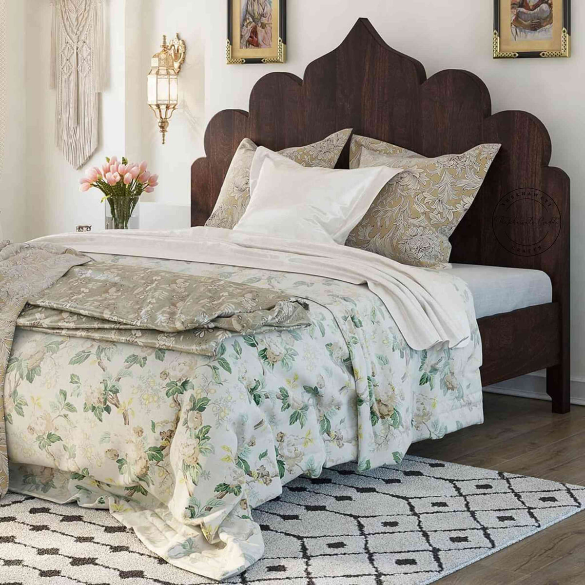 A king size Brassico bed made of Sheesham wood with a walnut finish, featuring a floral bedsheet and positioned against a wall.