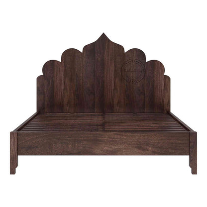 A king size Brassico bed made of Sheesham wood with a walnut finish on a white background.