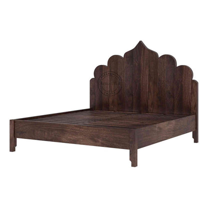 Side view of a king-size Brassico bed made of Sheesham wood with a walnut finish, in a white background.