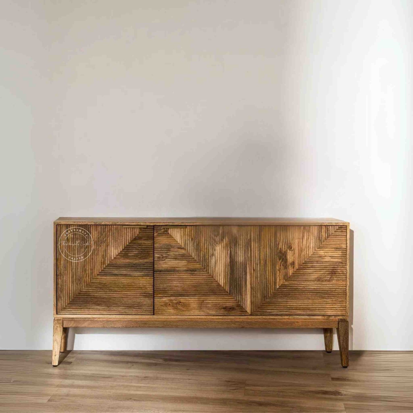 Brayan sideboard is handcrafted with mango wood. It has 3 doors and internal shelves for storage.