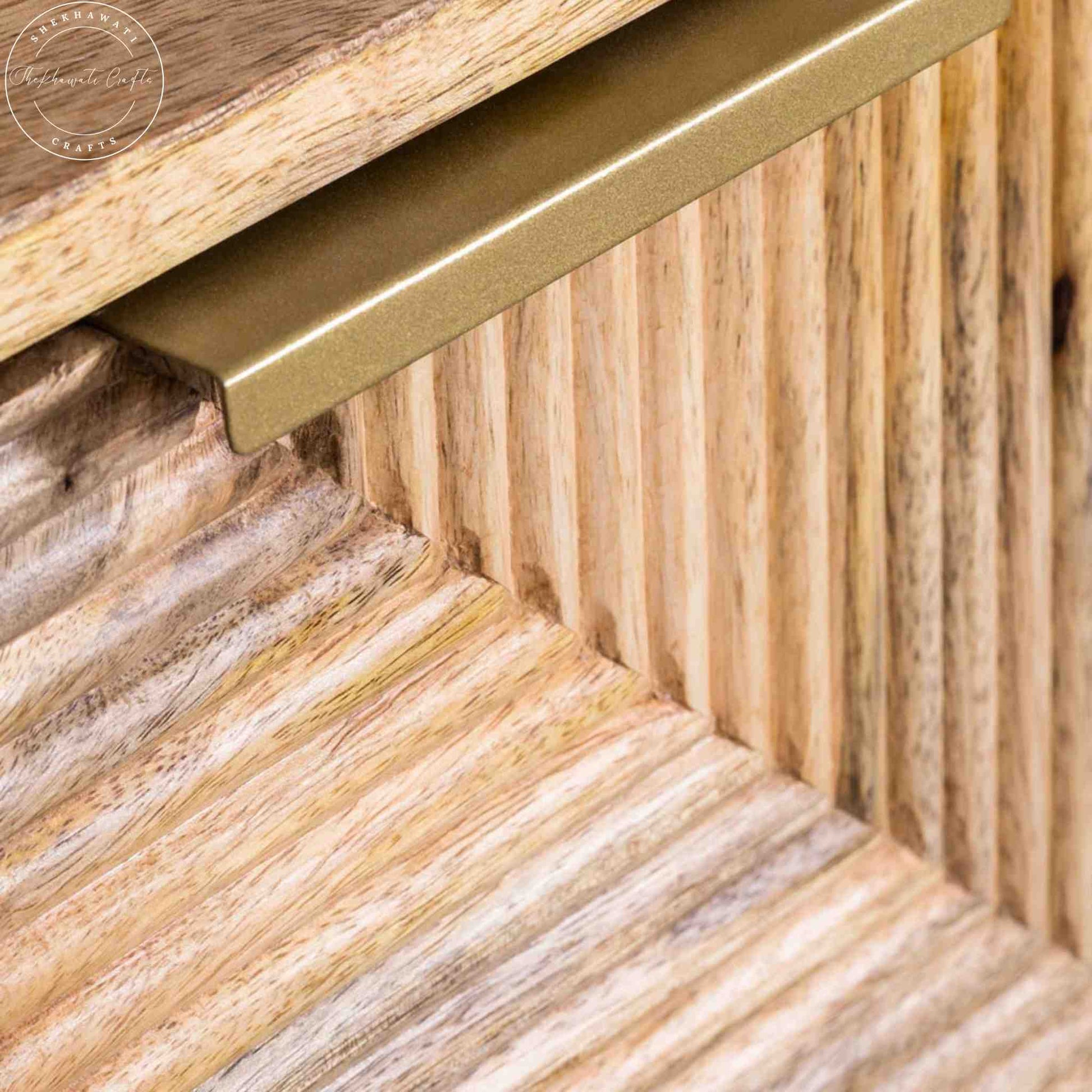 Brayan sideboard is handcrafted with mango wood. It has 3 doors and internal shelves for storage.