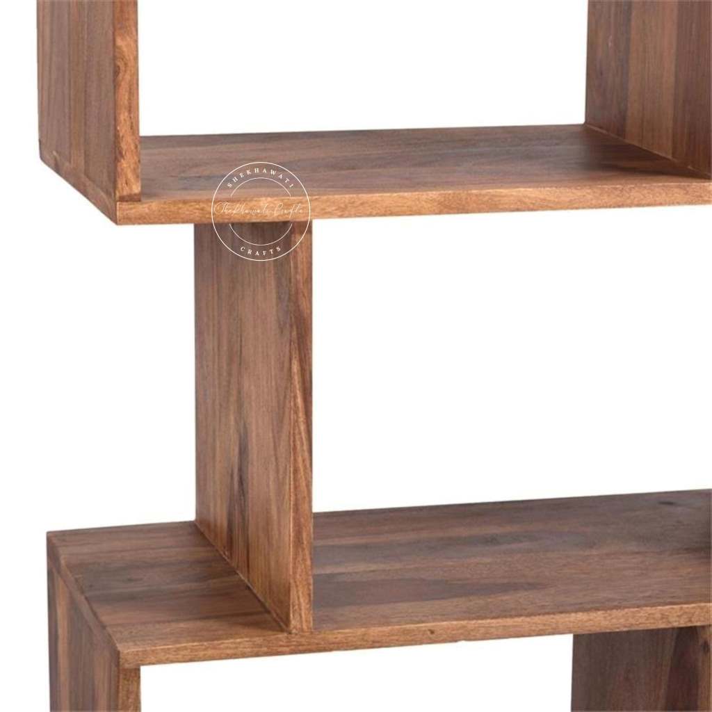 Close-up of the wooden bookshelf, a shelving unit with two visible shelves and a central support post.