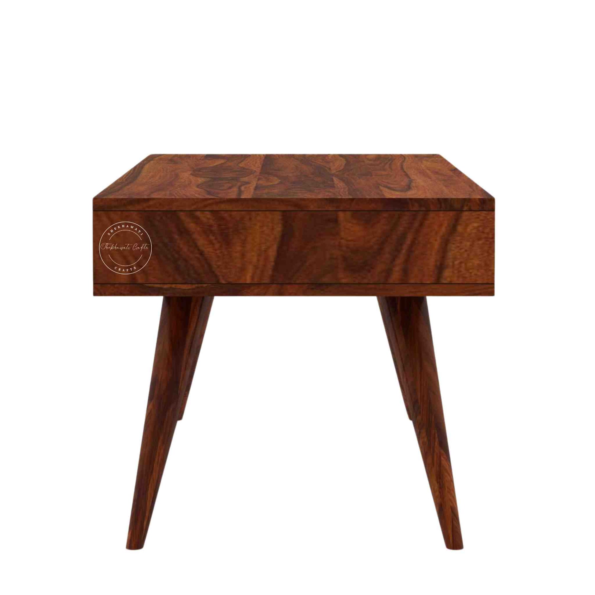 Esha Center Table is handcrafted from Sheesham wood with a honey finish, foldable legs, and a dual-side opening drawer.