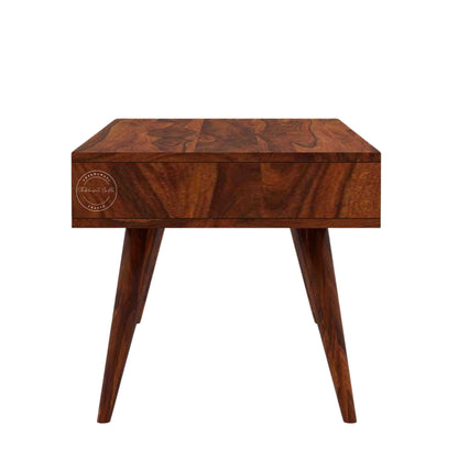 Esha Center Table is handcrafted from Sheesham wood with a honey finish, foldable legs, and a dual-side opening drawer.