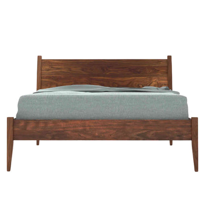 A king size bed made of Sheesham wood with a curved headboard is shown in a white background.