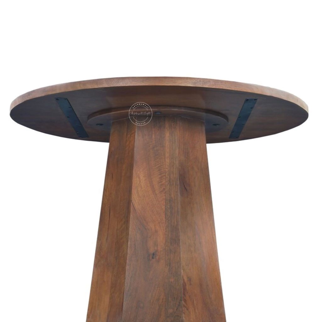 A close-up of a round wooden table top with a matching tapered pedestal base, showing the rich medium-brown wood grain.