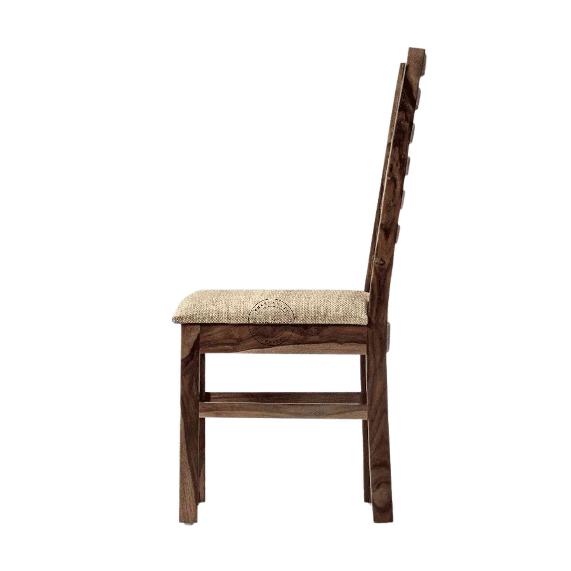 Given Chair is handcrafted from sheesham wood with a unique backrest design, comfortable seating cushion and a modern design.
