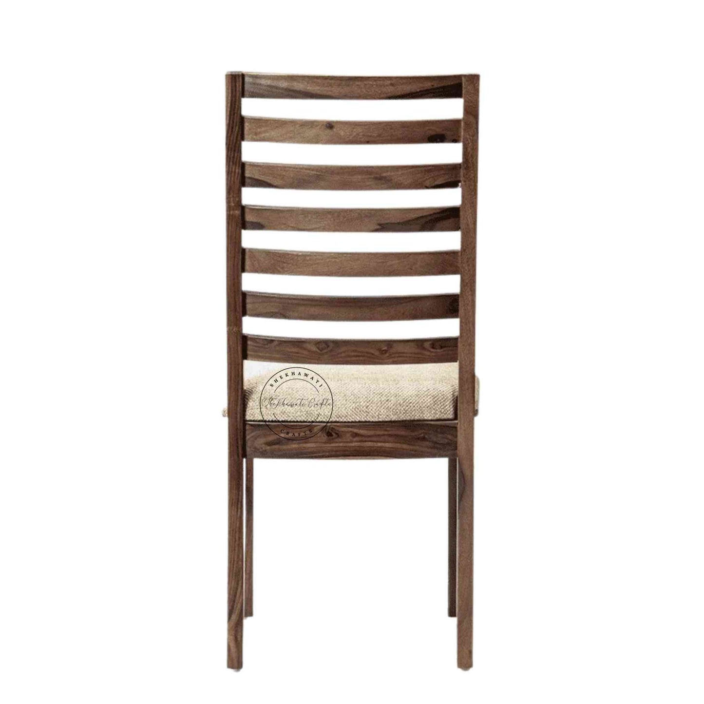 Given Chair is handcrafted from sheesham wood with a unique backrest design, comfortable seating cushion and a modern design.