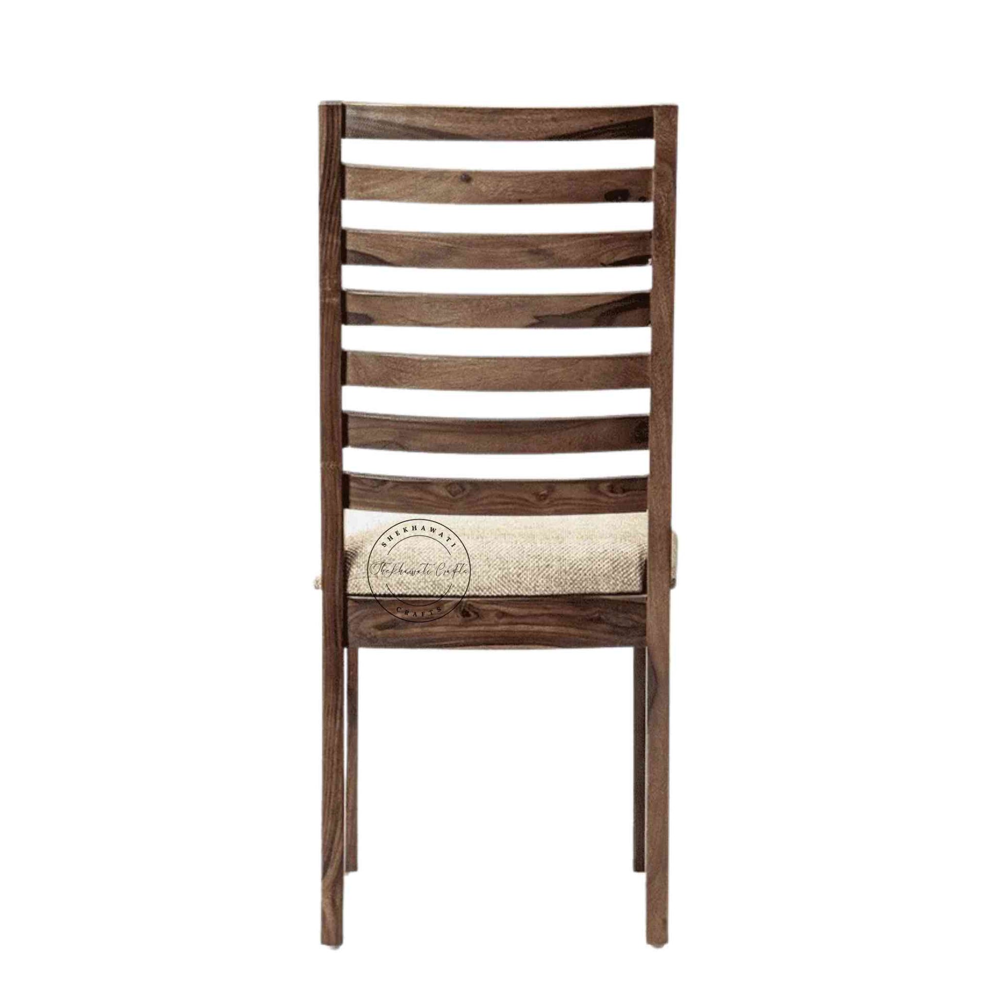 Given Chair is handcrafted from sheesham wood with a unique backrest design, comfortable seating cushion and a modern design.