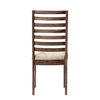Given Chair is handcrafted from sheesham wood with a unique backrest design, comfortable seating cushion and a modern design.