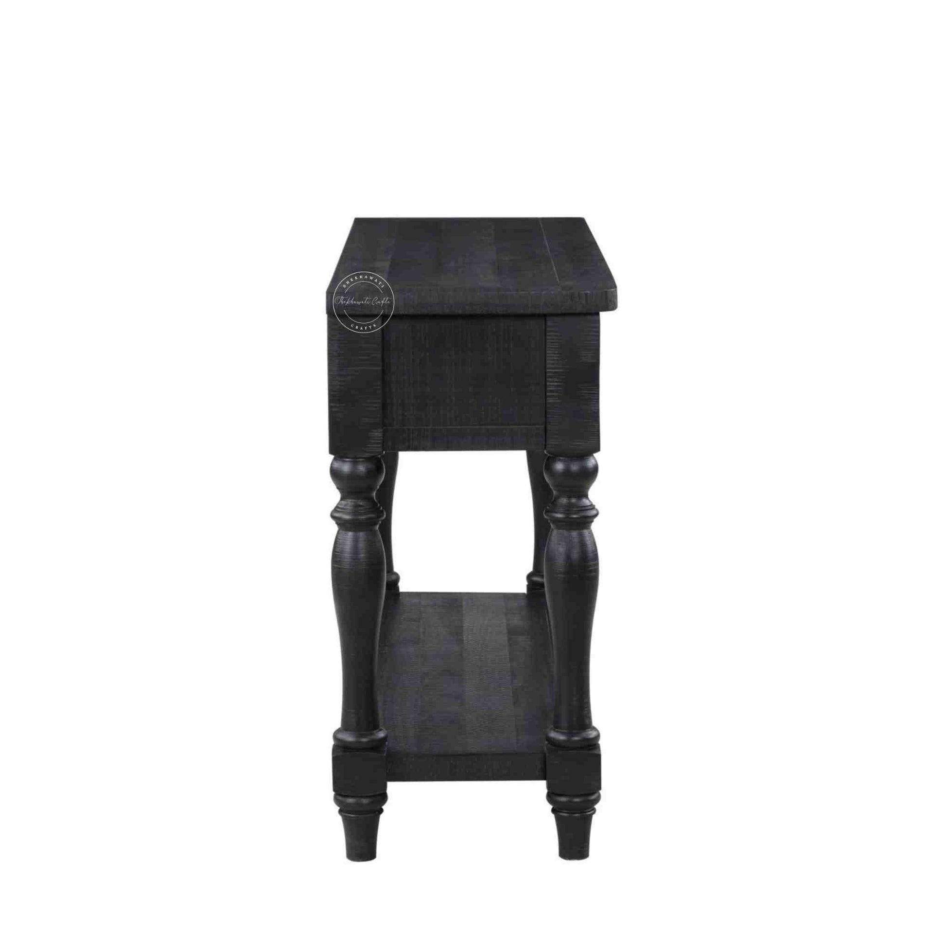 Julian console table is handcrafted from mango wood and a matte black finish.